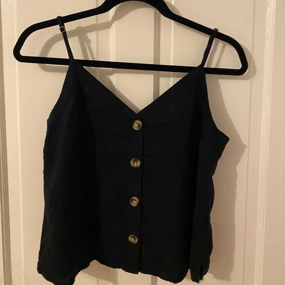 Navy blue tank with tortoise shell buttons.